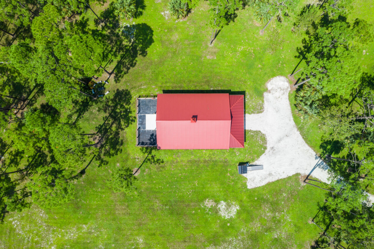 1835 Stallion Drive, Unit STALLS Loxahatchee, FL 33470 - Photo 28 of 35 an aerial view of a house with a yard and pool