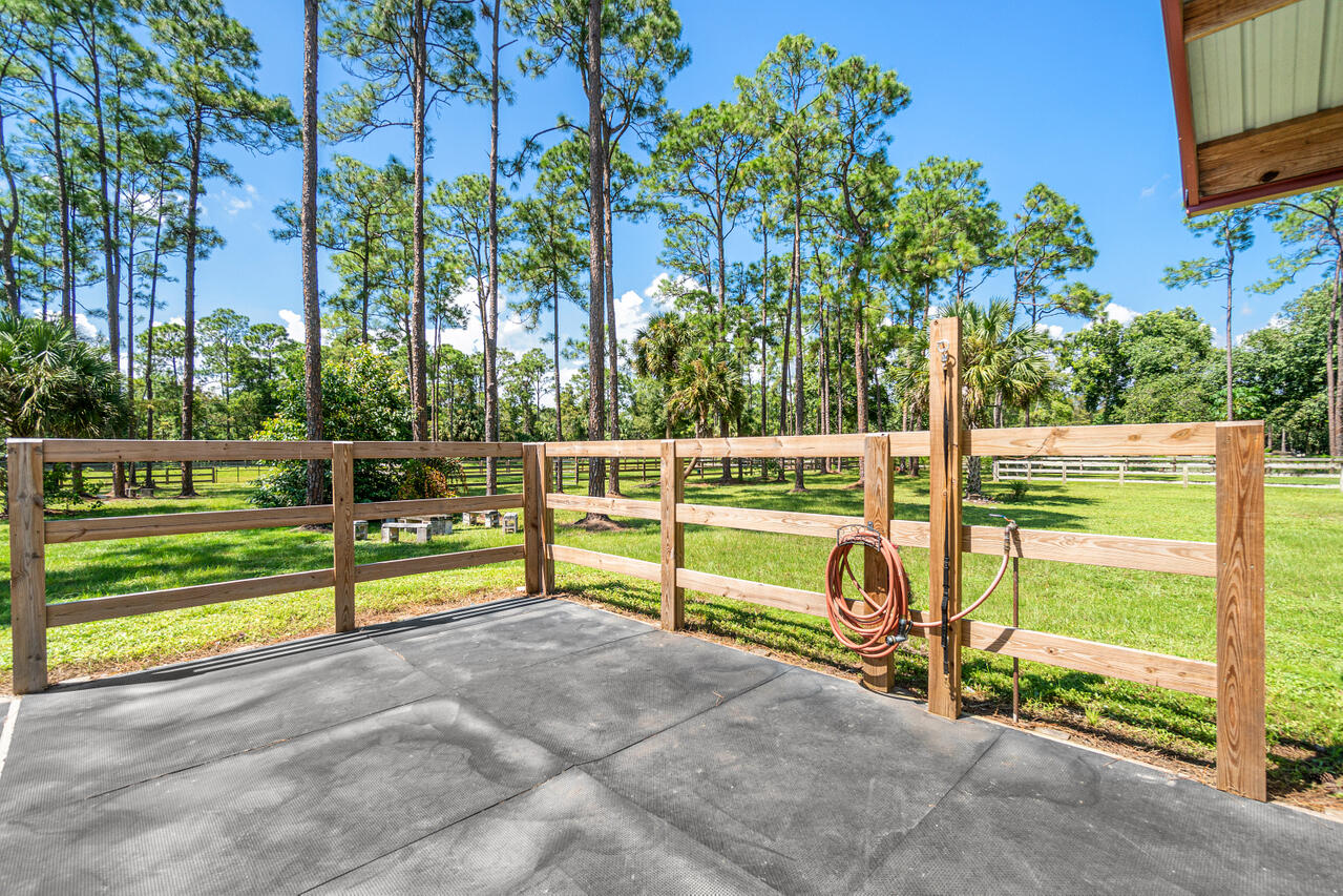 1835 Stallion Drive, Unit STALLS Loxahatchee, FL 33470 - Photo 8 of 35 a view of a yard with wooden fence