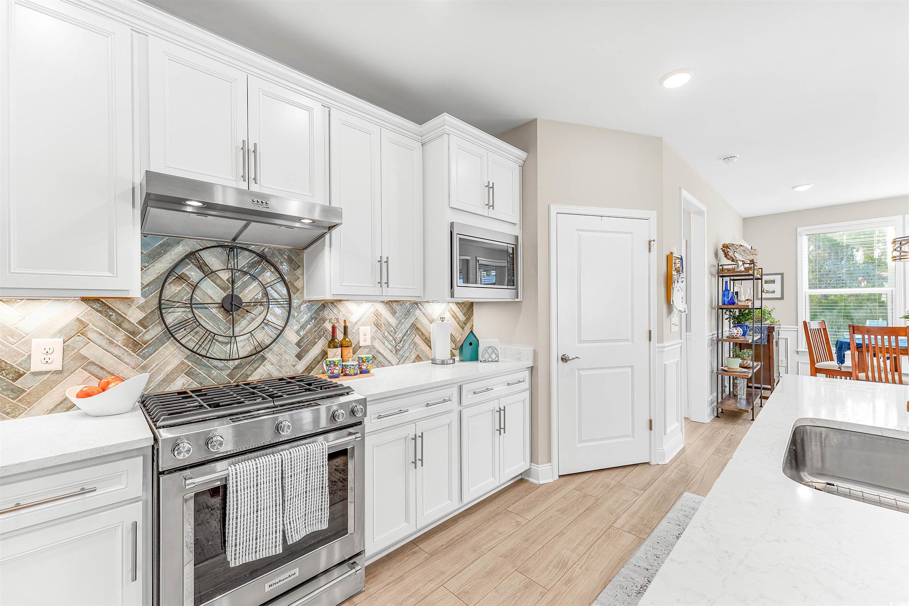 1577 Littleleaf Loop North Myrtle Beach, SC 29582 - Photo 11 of 40 Kitchen with decorative backsplash, light wood-sty