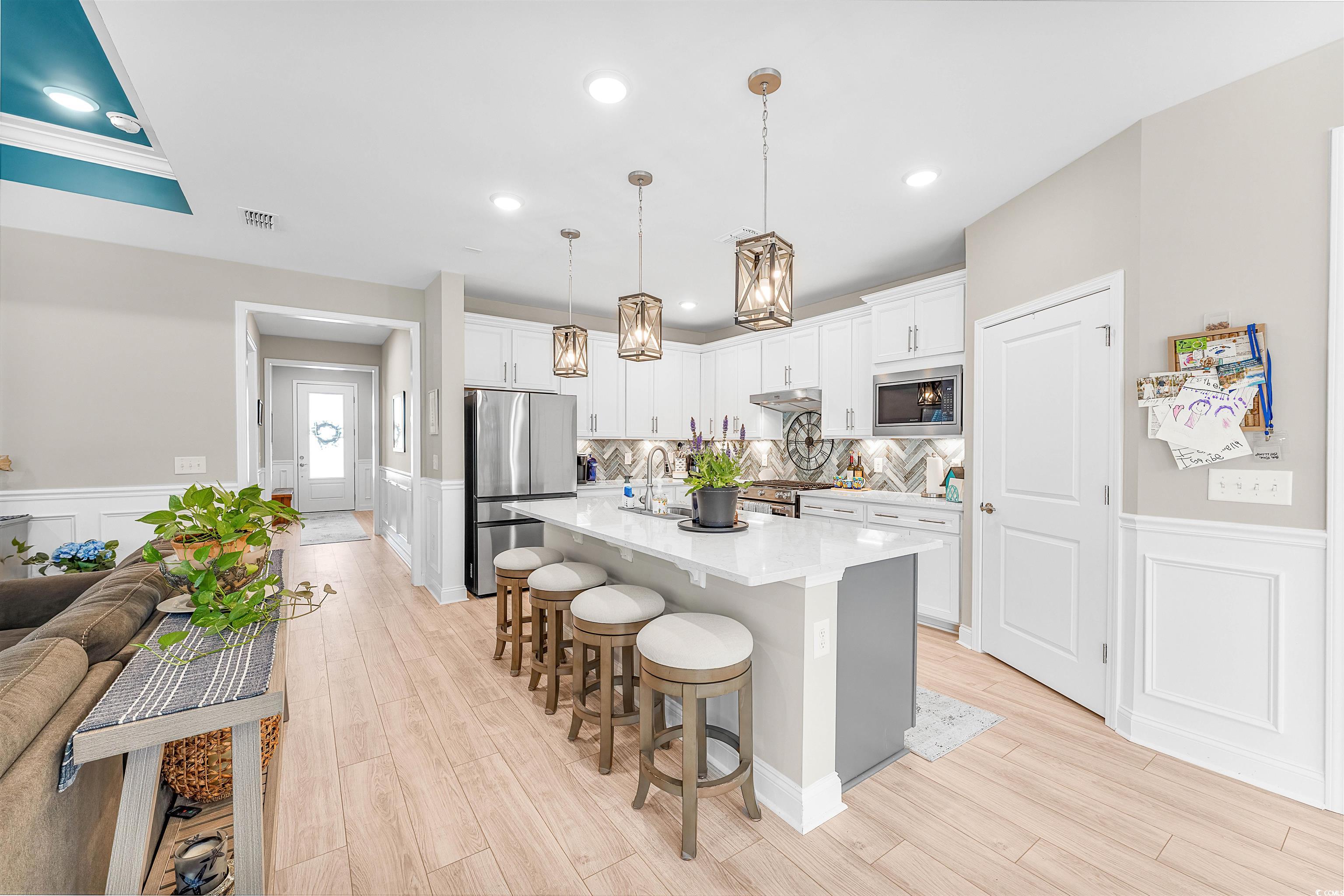 1577 Littleleaf Loop North Myrtle Beach, SC 29582 - Photo 12 of 40 Kitchen with light countertops, visible vents, a k