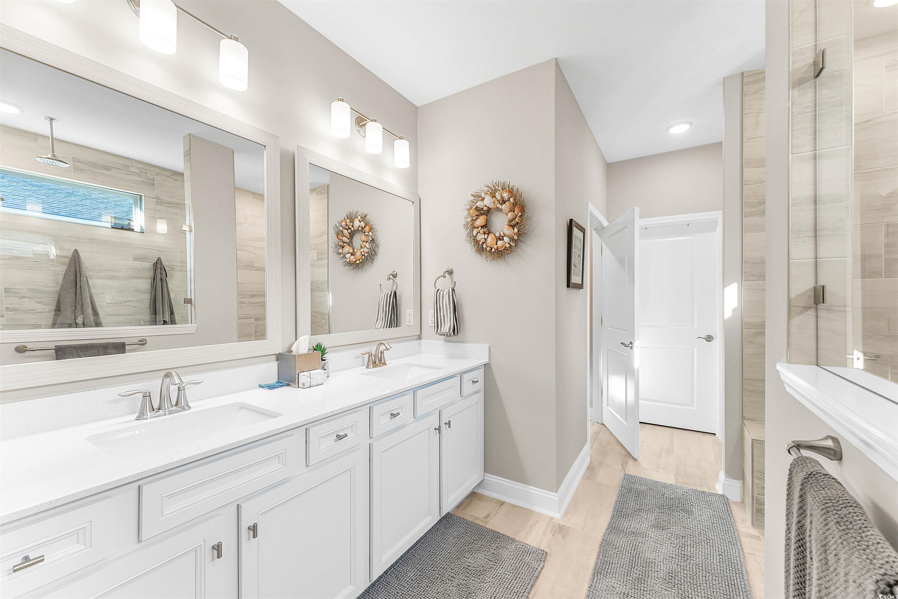 1577 Littleleaf Loop North Myrtle Beach, SC 29582 - Photo 18 of 40 Bathroom with double vanity, tiled shower, and a s