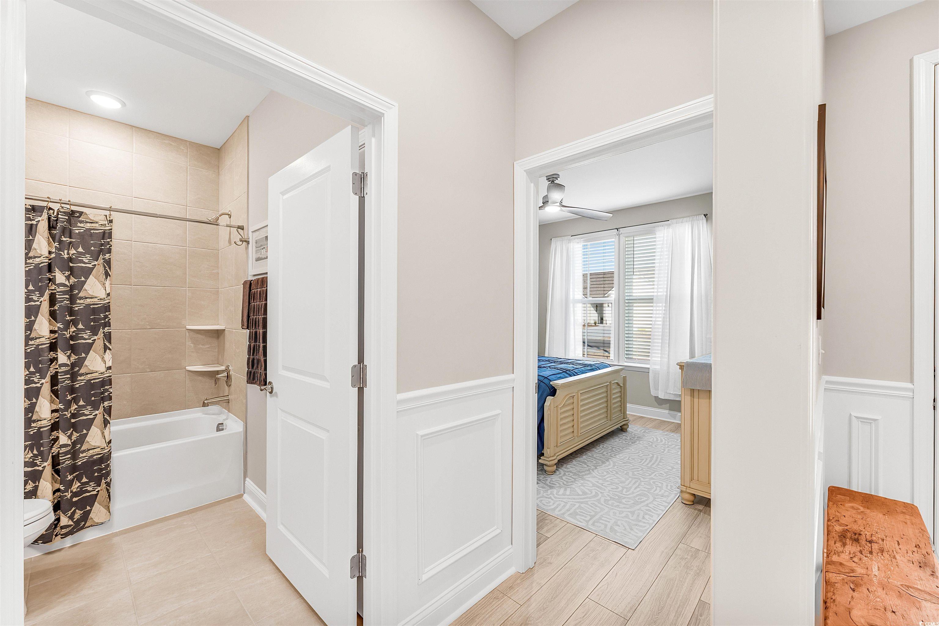 1577 Littleleaf Loop North Myrtle Beach, SC 29582 - Photo 20 of 40 Ensuite bathroom featuring toilet, wood finished f