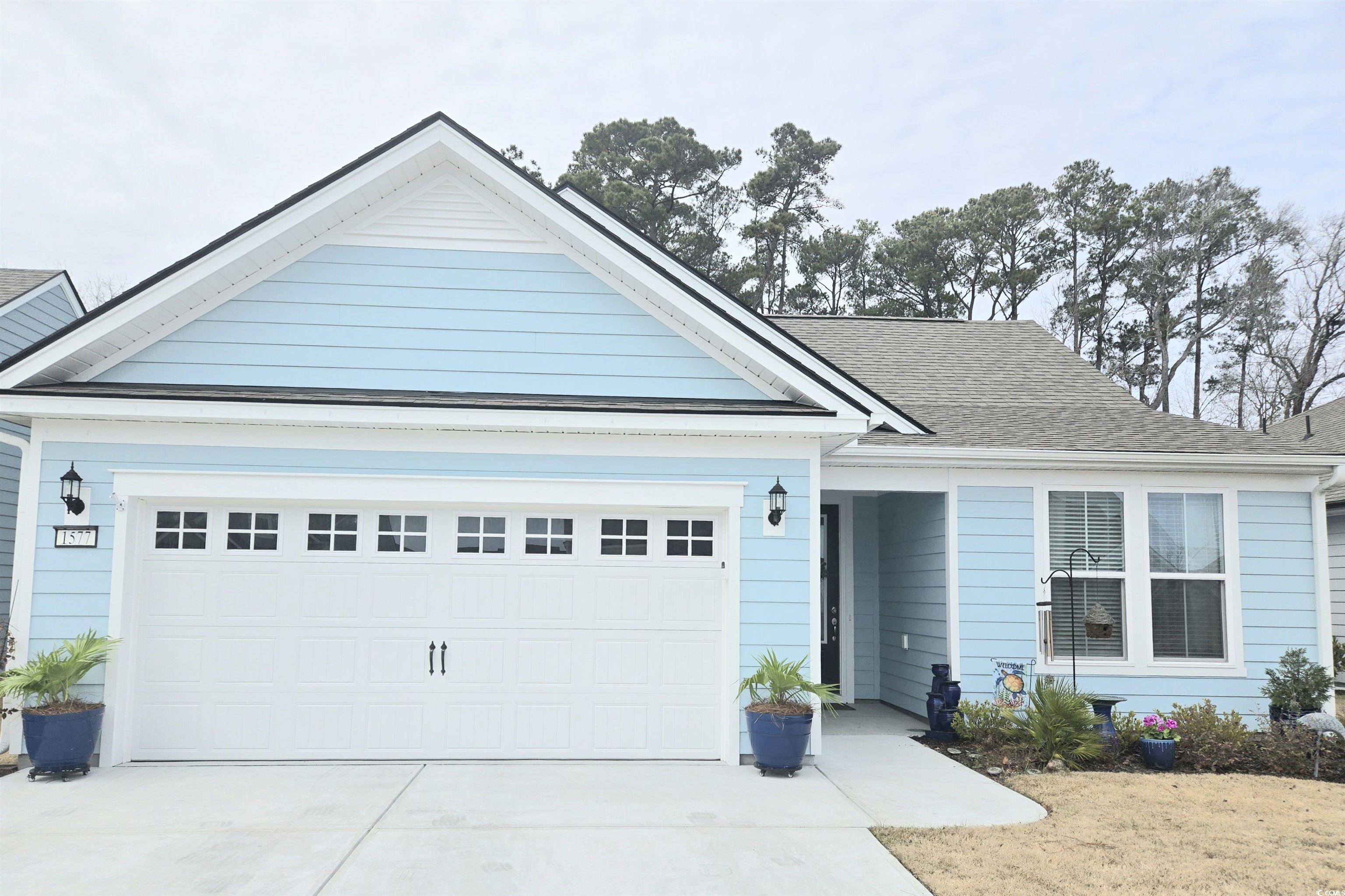 1577 Littleleaf Loop North Myrtle Beach, SC 29582 - Photo 2 of 40 Ranch-style home featuring driveway, a shingled ro