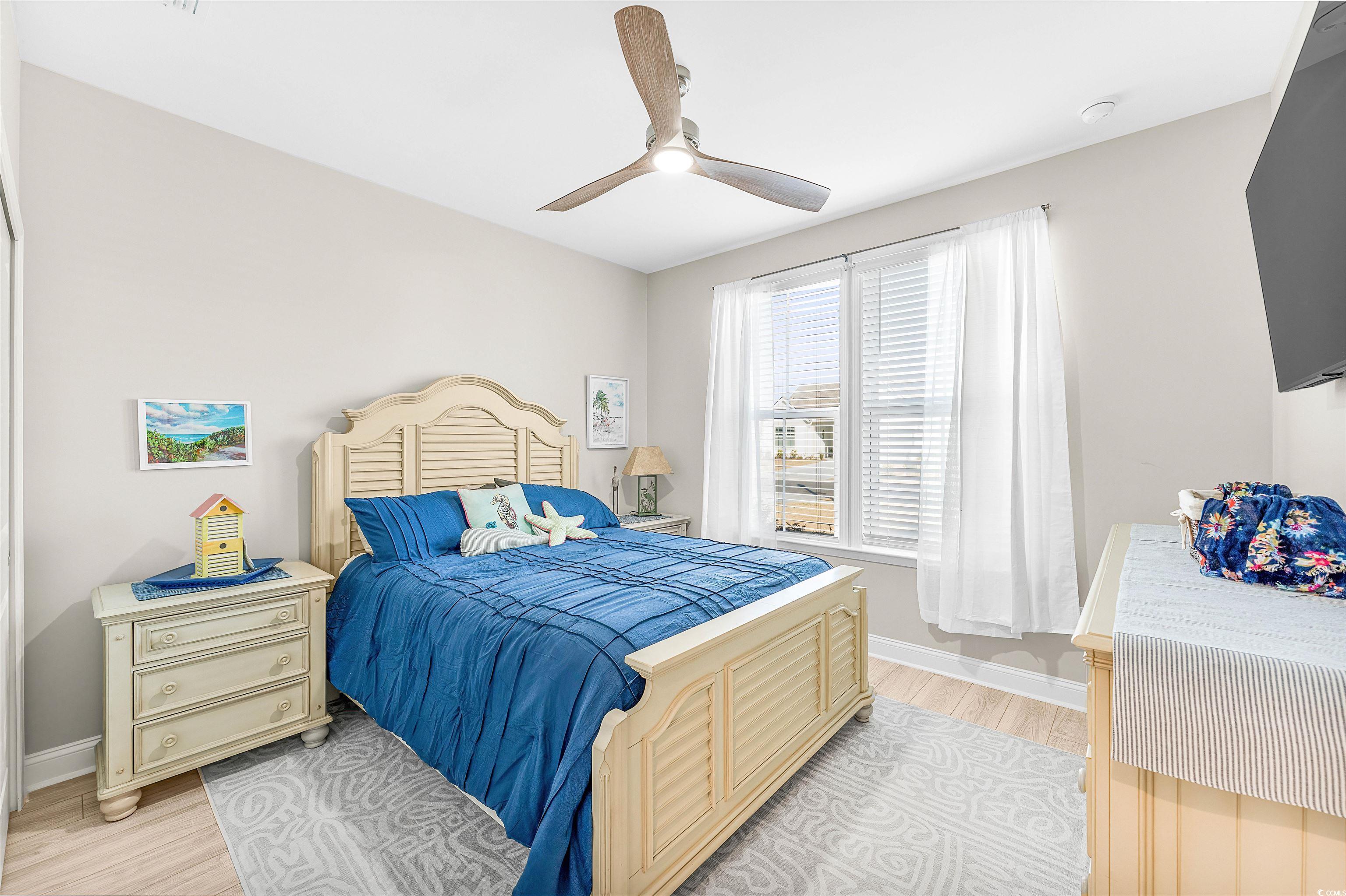 1577 Littleleaf Loop North Myrtle Beach, SC 29582 - Photo 22 of 40 Bedroom featuring baseboards, ceiling fan, and lig