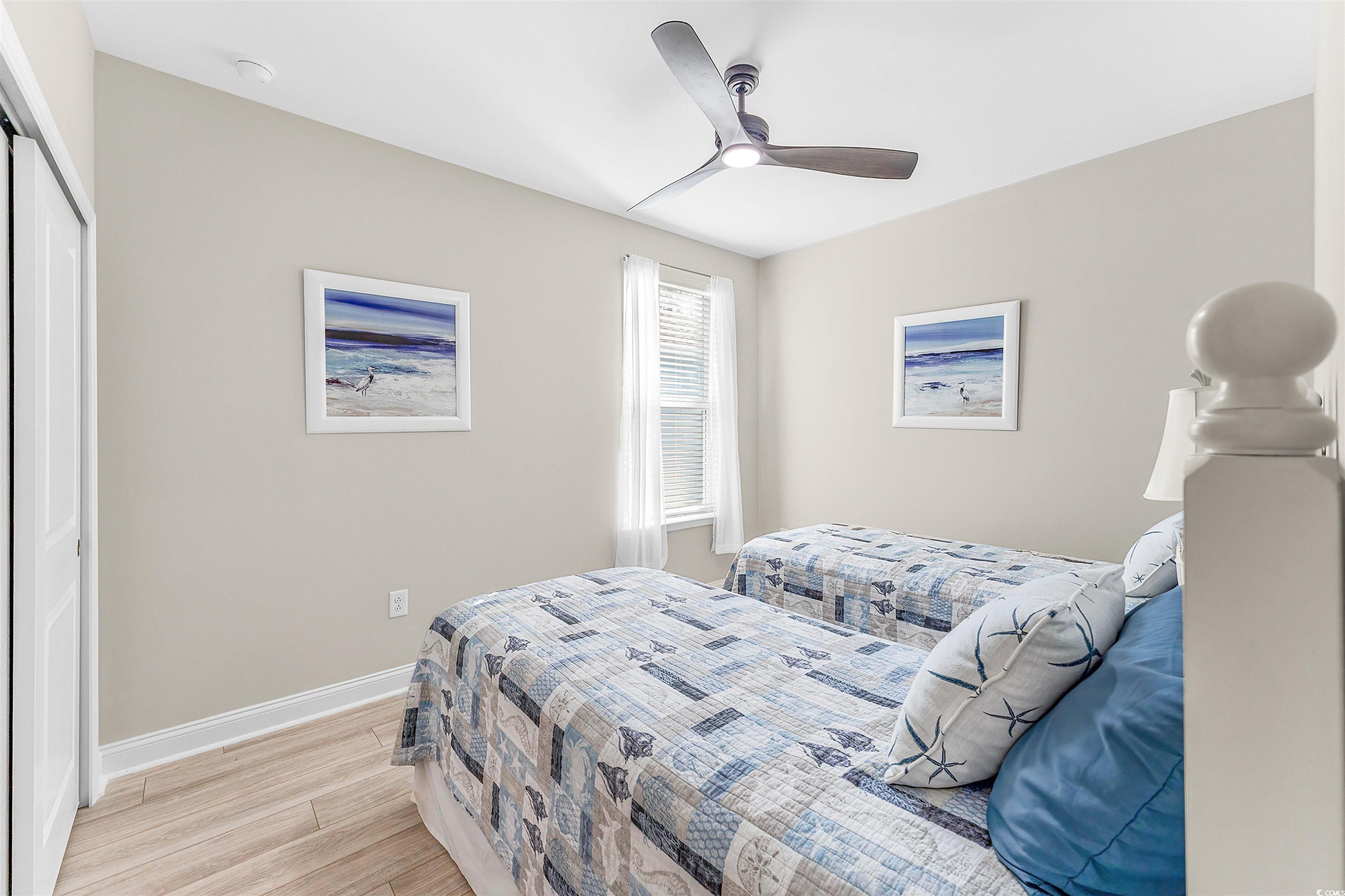 1577 Littleleaf Loop North Myrtle Beach, SC 29582 - Photo 25 of 40 Bedroom featuring baseboards, a ceiling fan, a clo