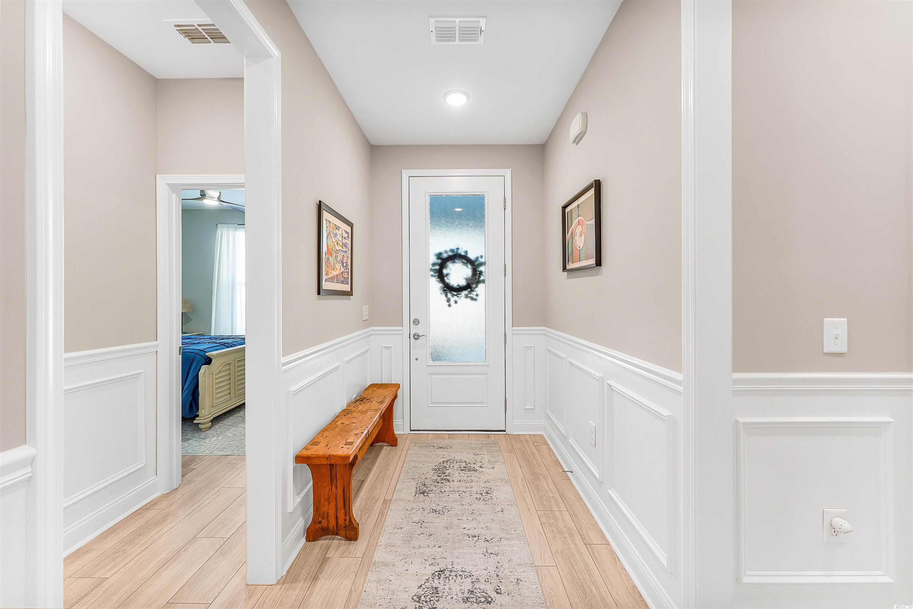 1577 Littleleaf Loop North Myrtle Beach, SC 29582 - Photo 5 of 40 Entryway with visible vents, wood finish floors, a