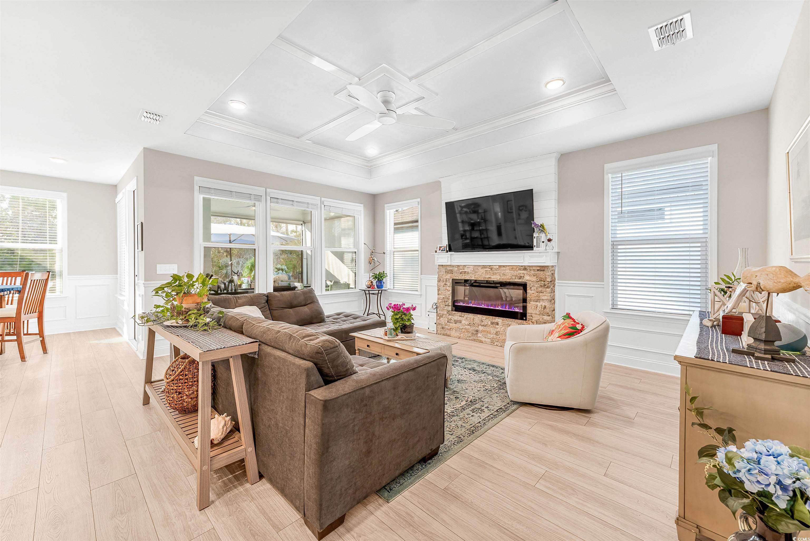 1577 Littleleaf Loop North Myrtle Beach, SC 29582 - Photo 7 of 40 Living room with a fireplace, ceiling fan, visible