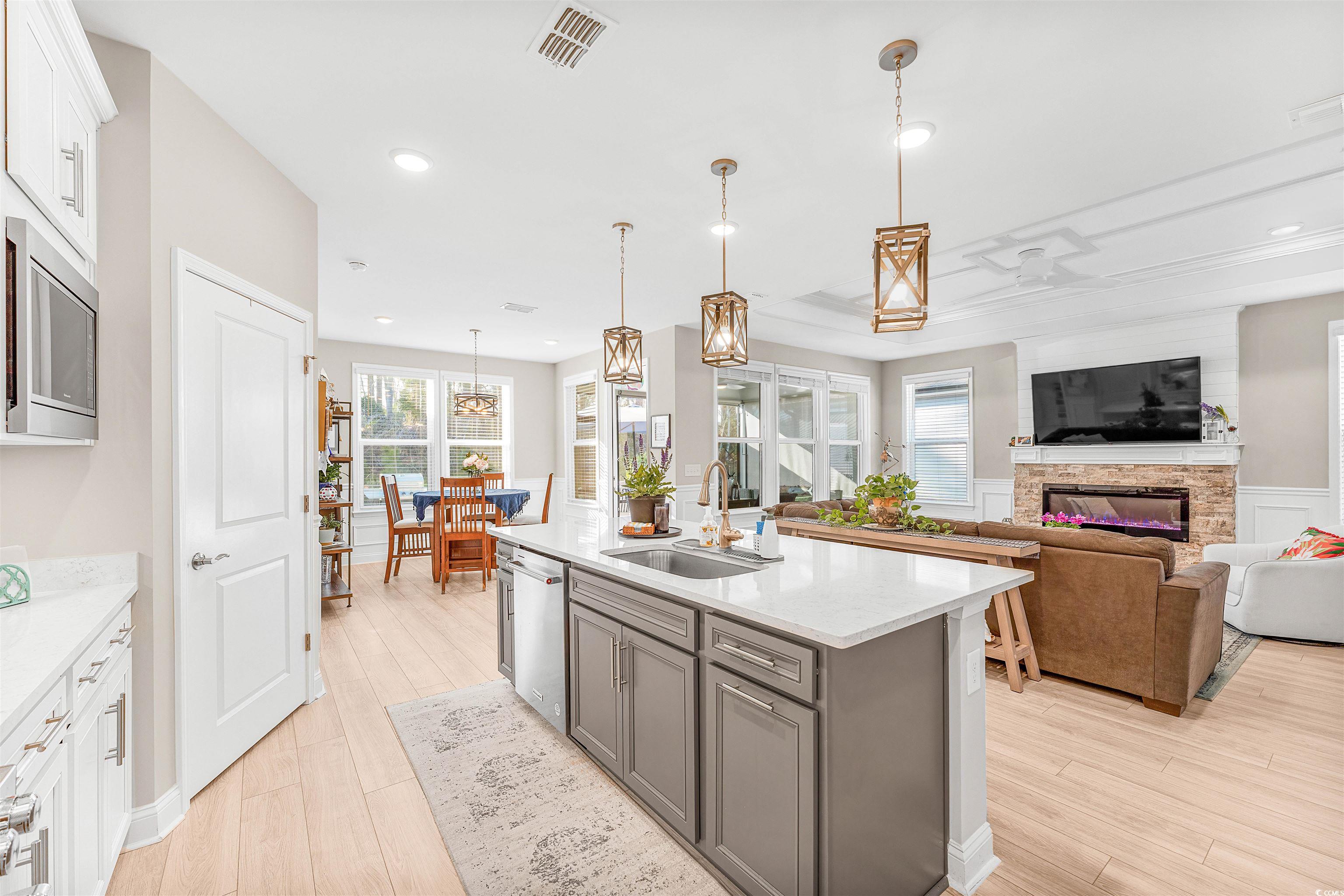 1577 Littleleaf Loop North Myrtle Beach, SC 29582 - Photo 9 of 40 Kitchen featuring light countertops, gray cabinetr
