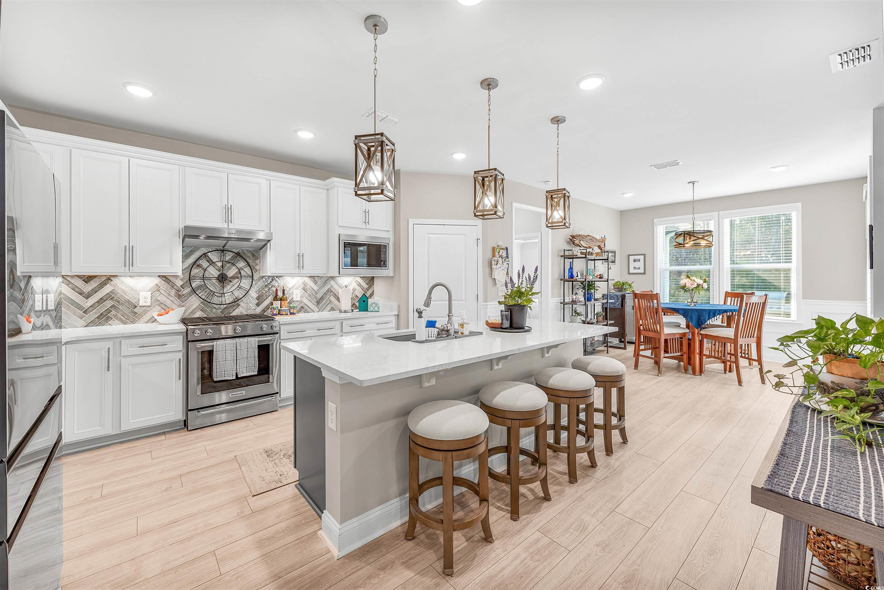 1577 Littleleaf Loop North Myrtle Beach, SC 29582 - Photo 10 of 40 Kitchen featuring light countertops, a sink, under