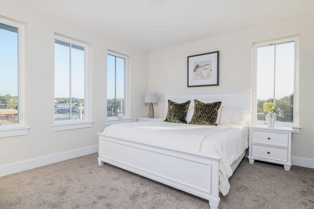 488 Quincy Avenue, Unit 13 Quincy, MA 02169 - Photo 13 of 23 a bedroom with a bed and a window