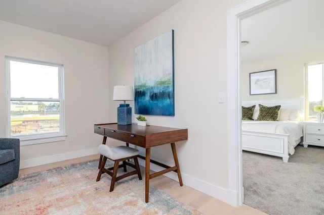 a workspace with furniture and window