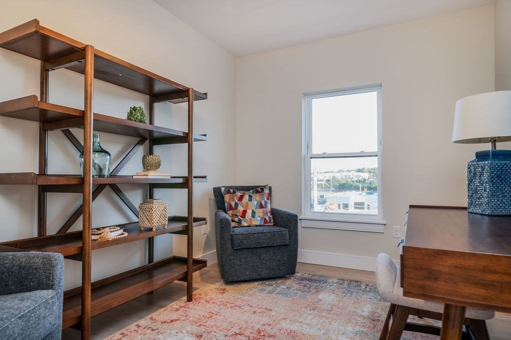 488 Quincy Avenue, Unit 13 Quincy, MA 02169 - Photo 17 of 23 a living room with furniture a window and a window