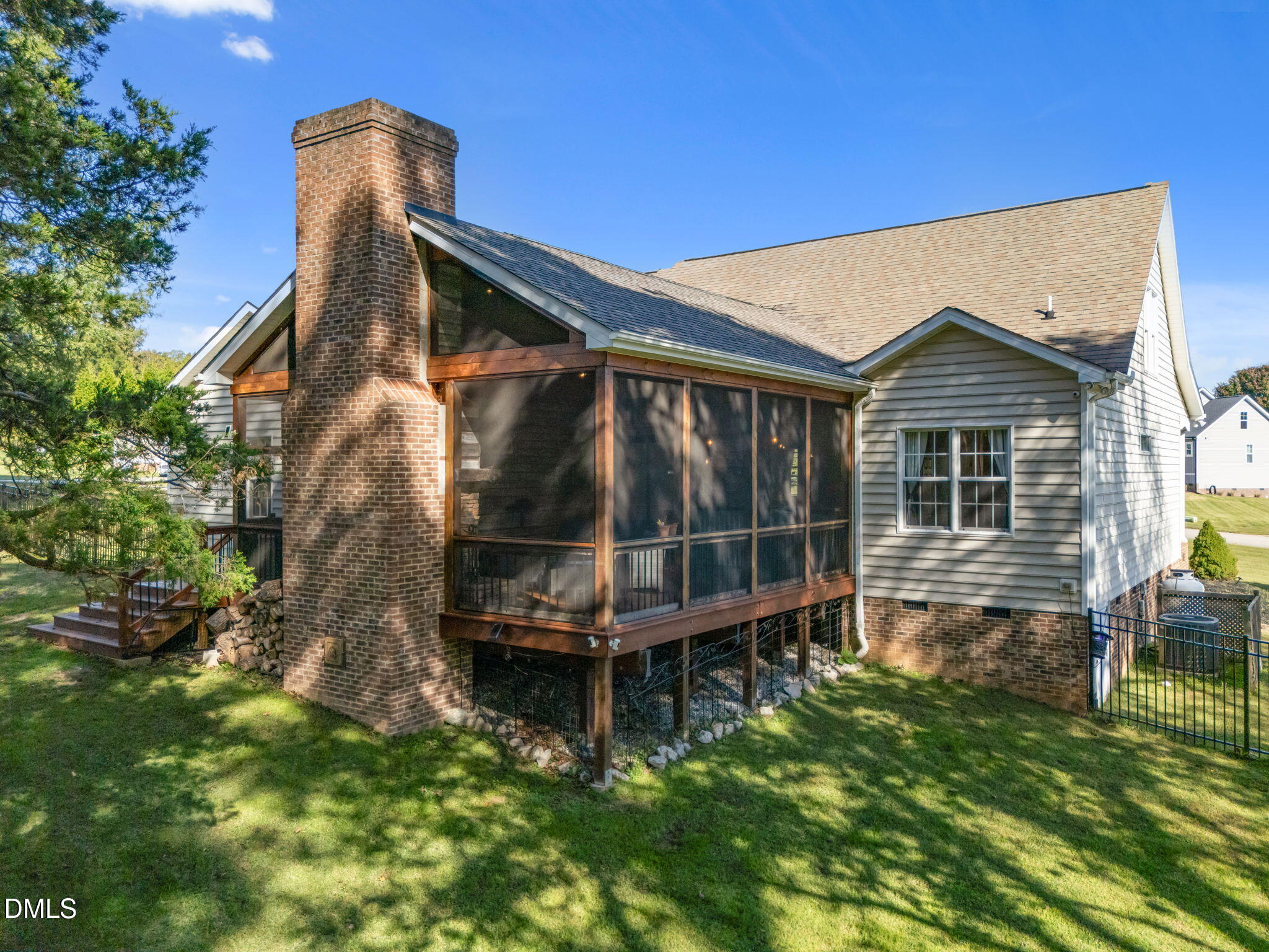 236 Derwin Drive Timberlake, NC 27583 - Photo 14 of 45 a backyard of a house with large trees and table