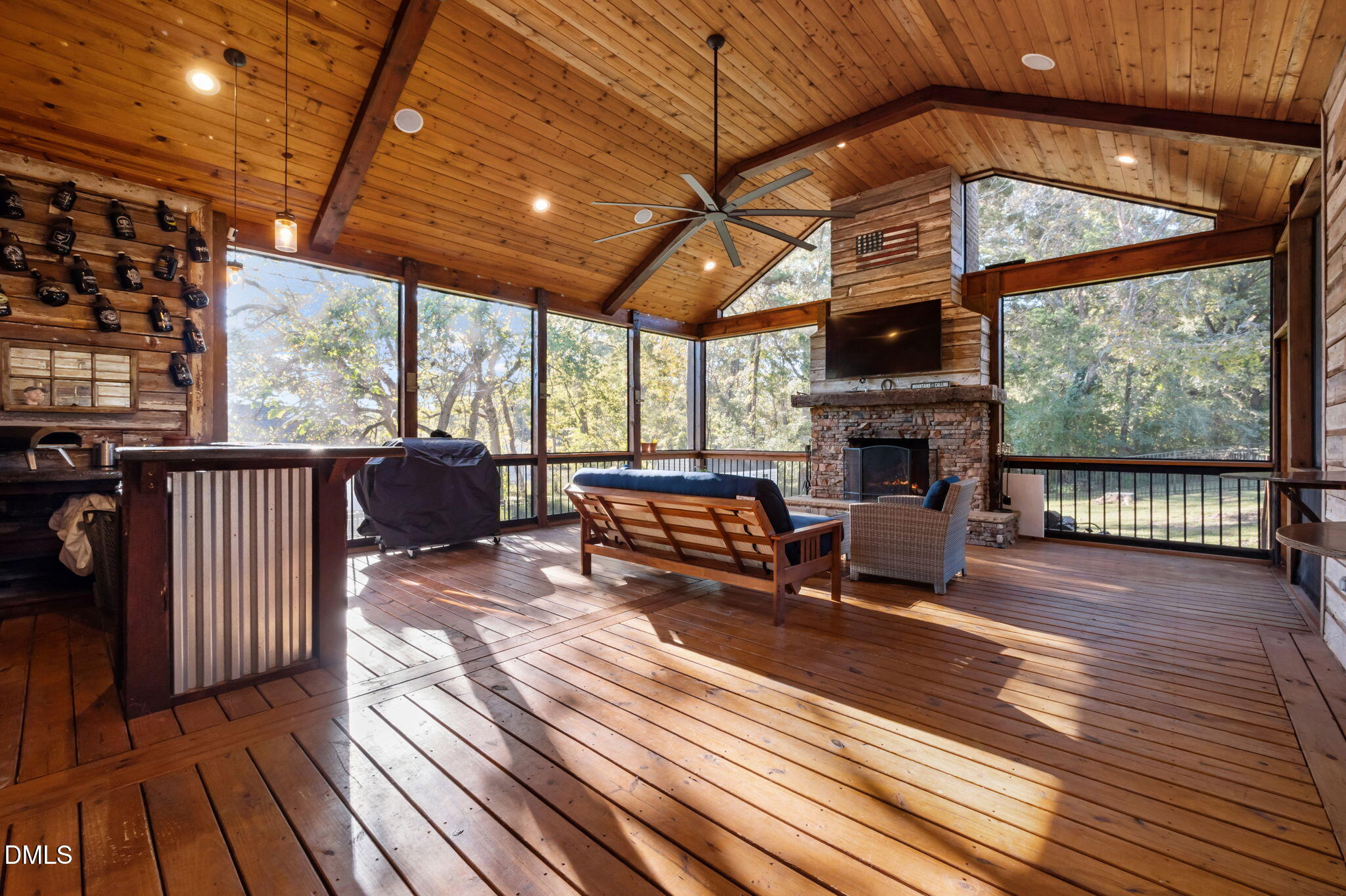 236 Derwin Drive Timberlake, NC 27583 - Photo 16 of 45 a view of a patio with wooden floor a fire pit and furniture