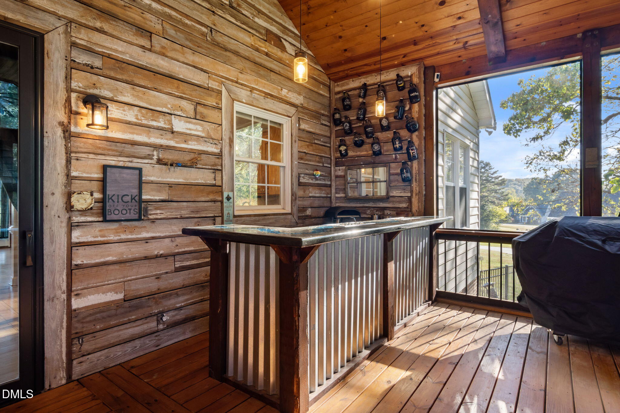 236 Derwin Drive Timberlake, NC 27583 - Photo 18 of 45 a view of a porch with two chairs and wooden floor