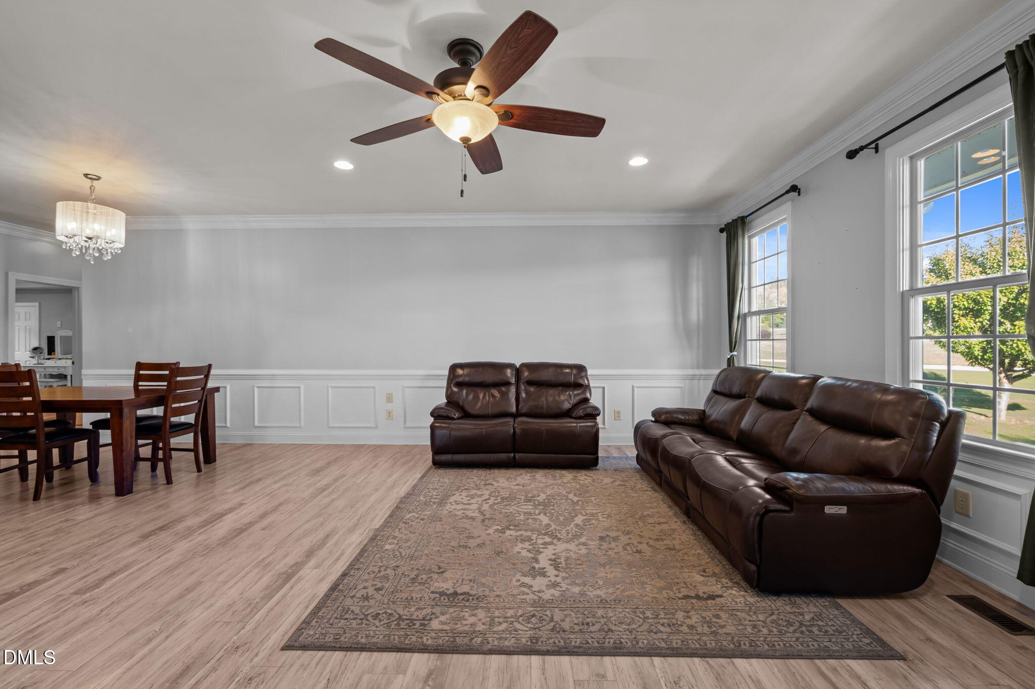 236 Derwin Drive Timberlake, NC 27583 - Photo 21 of 45 a living room with furniture and a wooden floor