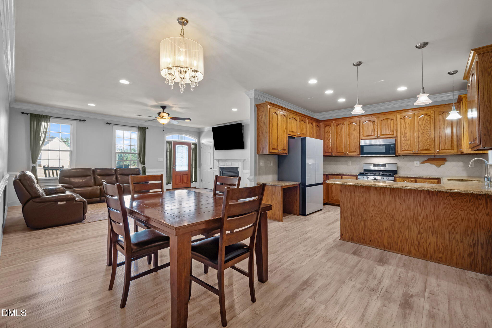 236 Derwin Drive Timberlake, NC 27583 - Photo 24 of 45 a view of a dining room with furniture a kitchen and chandelier