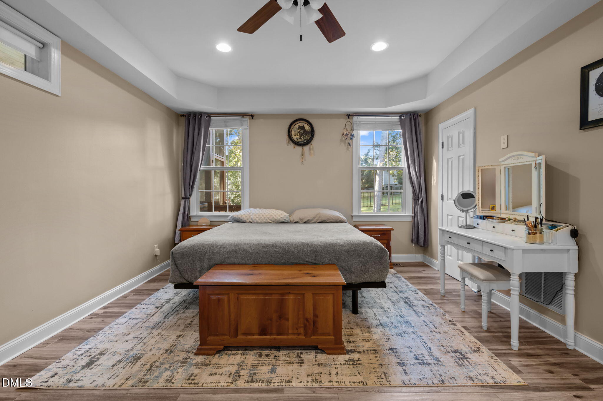 236 Derwin Drive Timberlake, NC 27583 - Photo 30 of 45 a bedroom with a bed a dresser and wooden floor