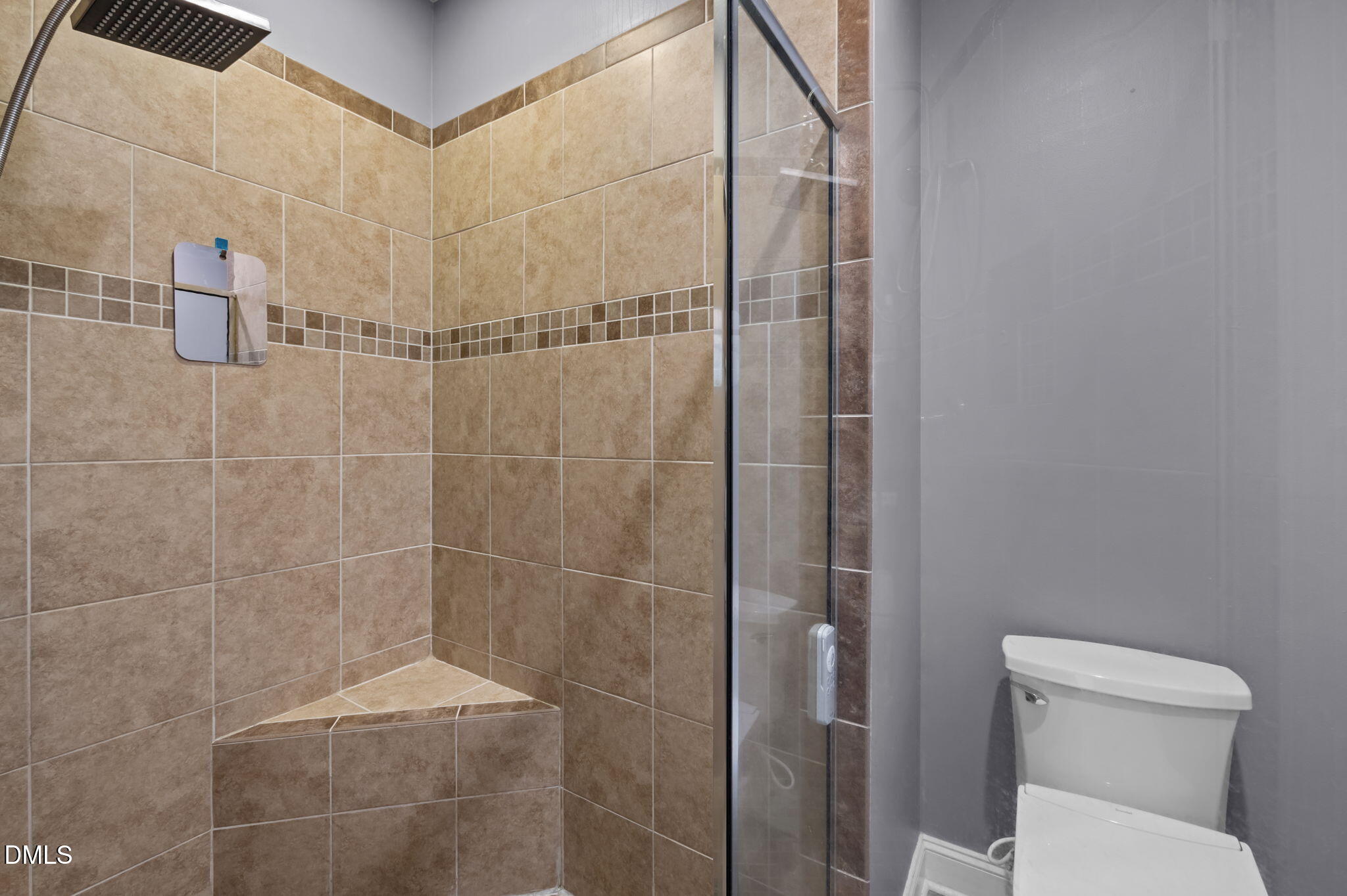 236 Derwin Drive Timberlake, NC 27583 - Photo 32 of 45 a bathroom with a toilet and shower