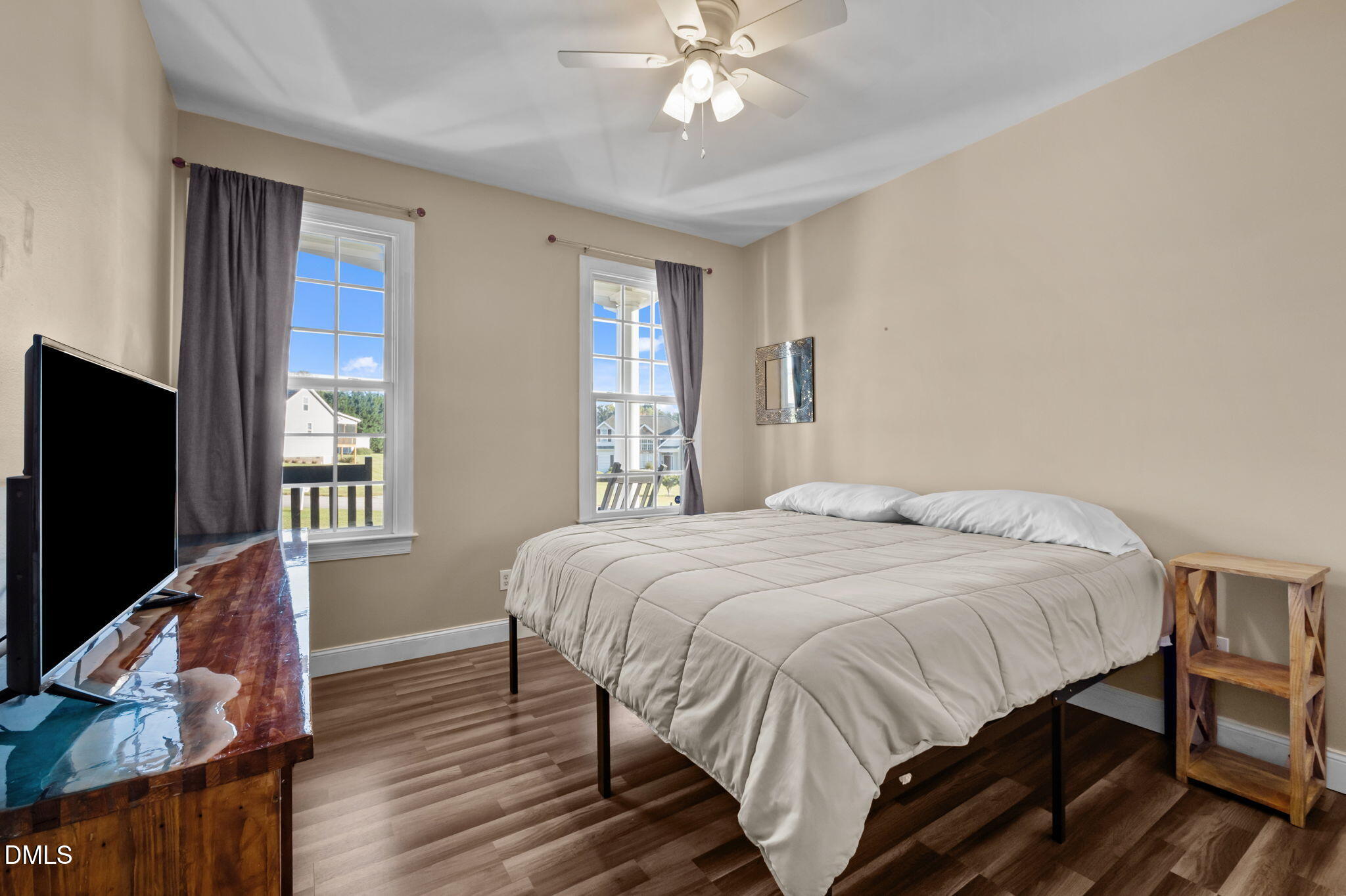 236 Derwin Drive Timberlake, NC 27583 - Photo 33 of 45 a bedroom with a bed and a flat screen tv