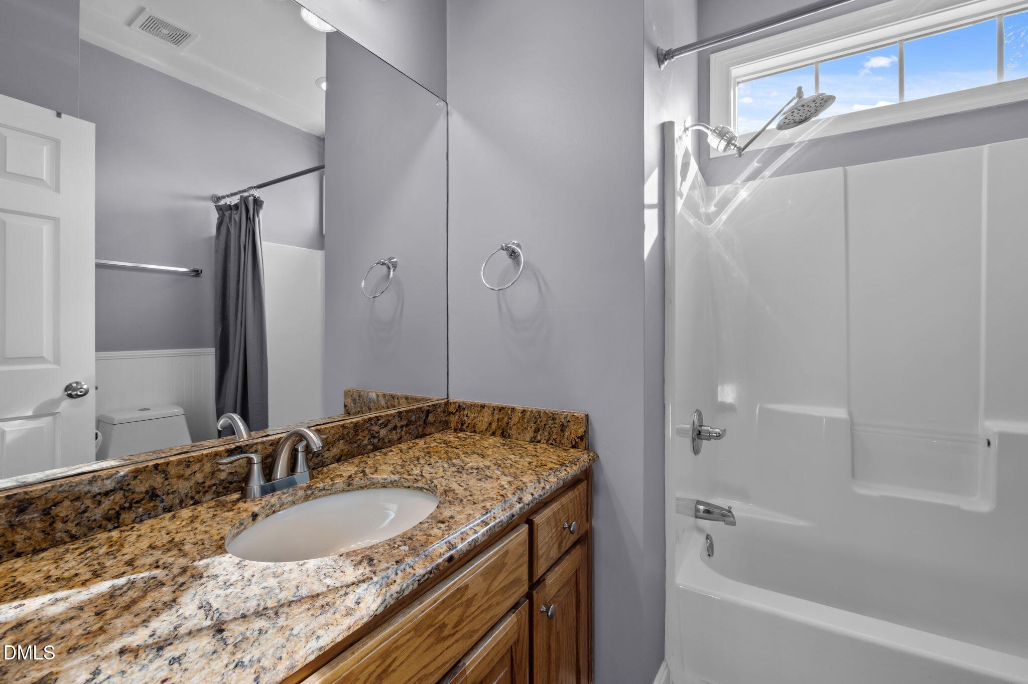 236 Derwin Drive Timberlake, NC 27583 - Photo 35 of 45 a bathroom with a granite countertop sink and a mirror