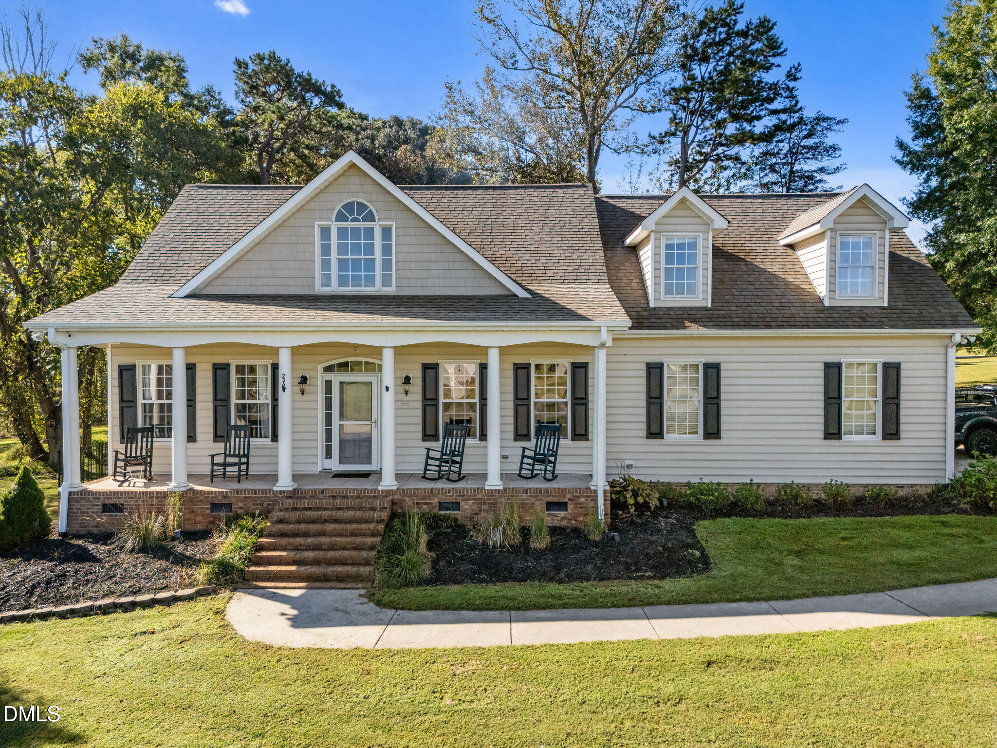 236 Derwin Drive Timberlake, NC 27583 - Photo 3 of 45 a front view of a house with a yard table and chairs