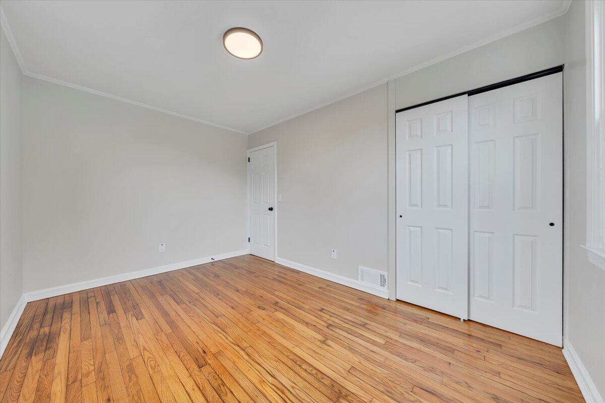 1004 26th Street Southwest Roanoke, VA 24015 - Photo 12 of 27 a view of an empty room with wooden floor