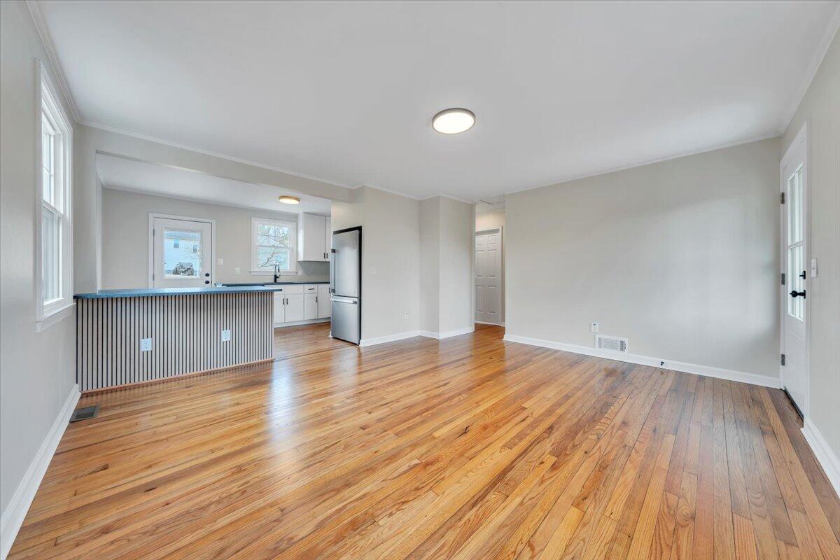 1004 26th Street Southwest Roanoke, VA 24015 - Photo 4 of 27 a view of kitchen and hall with wooden floor