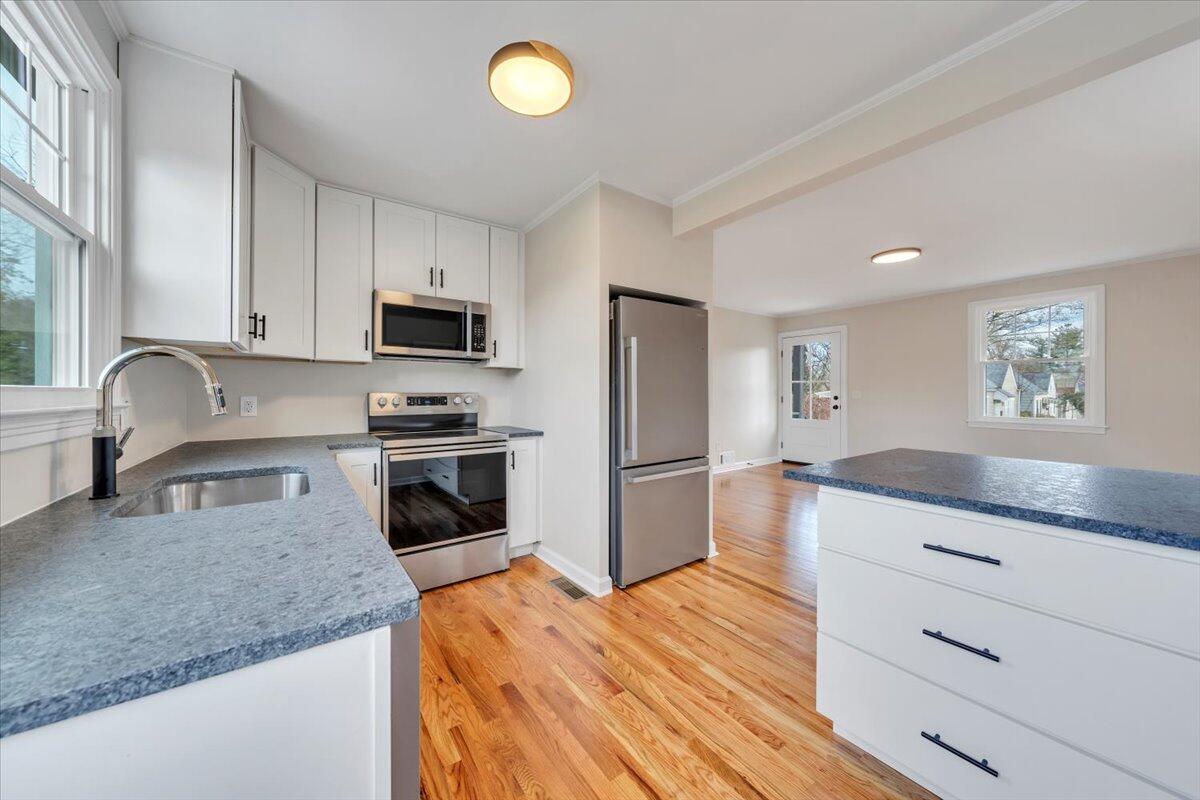1004 26th Street Southwest Roanoke, VA 24015 - Photo 10 of 27 a kitchen with granite countertop a refrigerator stove and sink