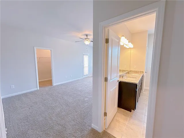 a view of a bathroom from a hallway