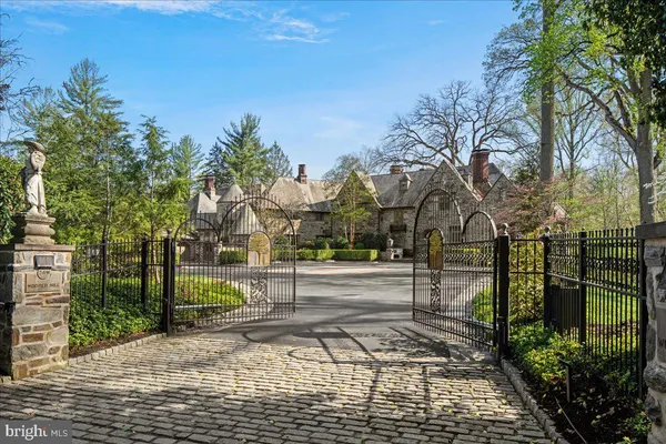a aerial view of a house with swimming pool and a yard