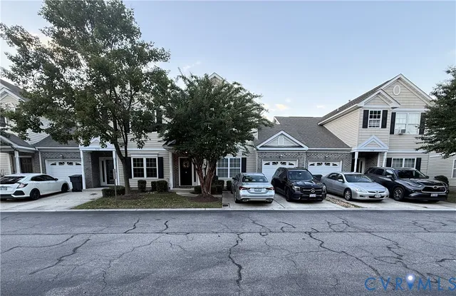 a view of a car park in front of house