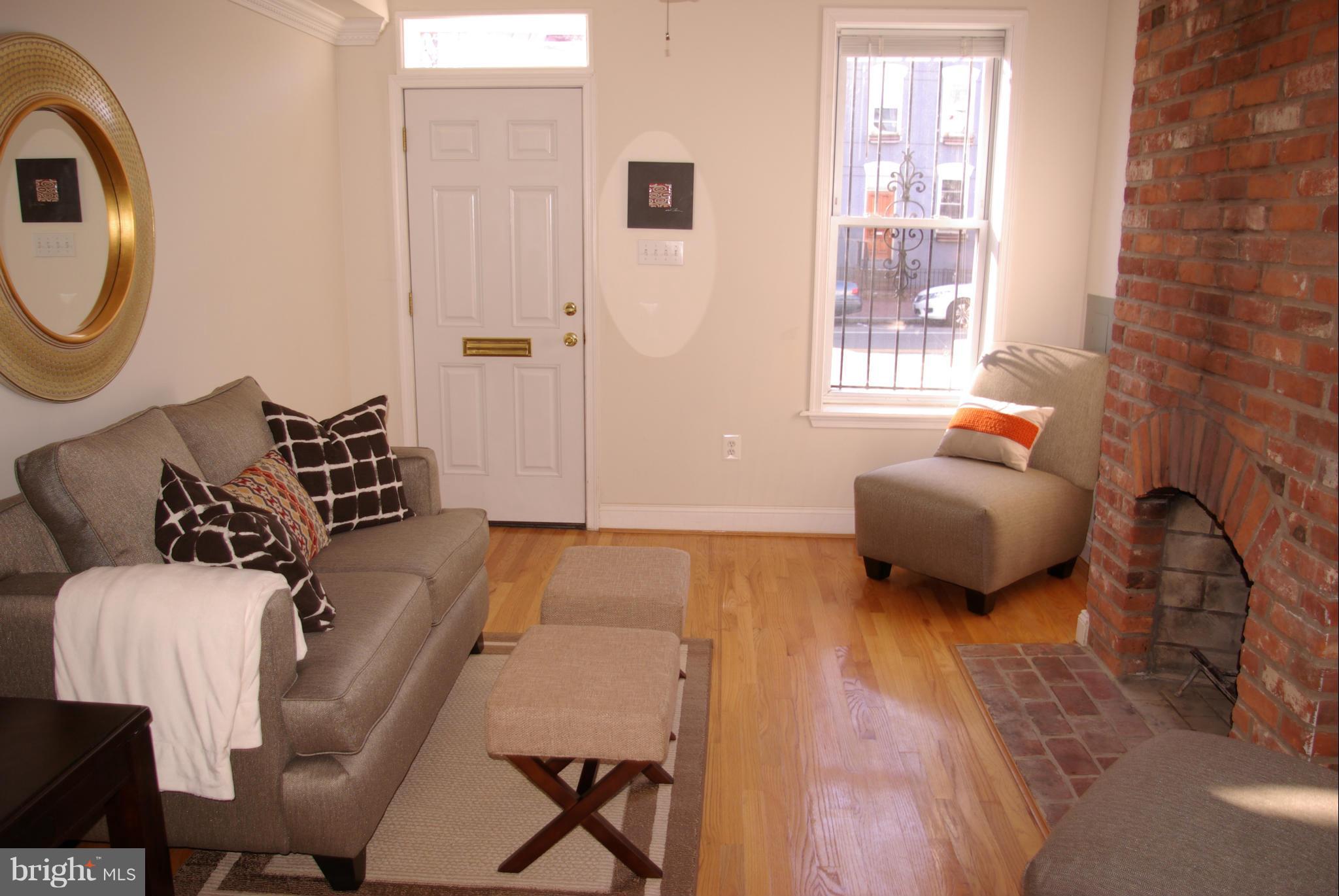 318 11th Street Southeast Washington, DC 20003 - Photo 2 of 26 a bedroom with furniture and a window