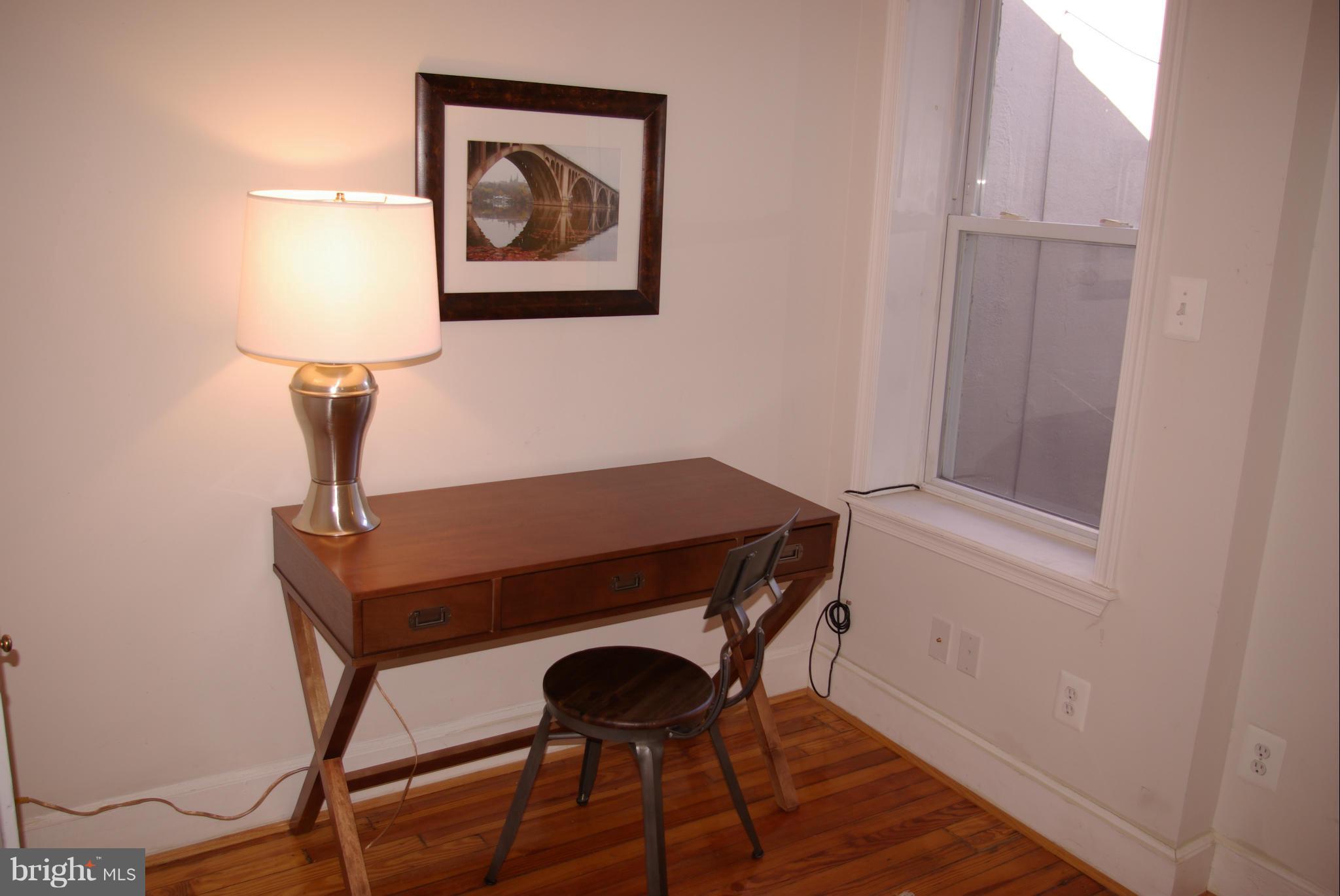 318 11th Street Southeast Washington, DC 20003 - Photo 20 of 26 a view of a hallway with furniture and wooden floor