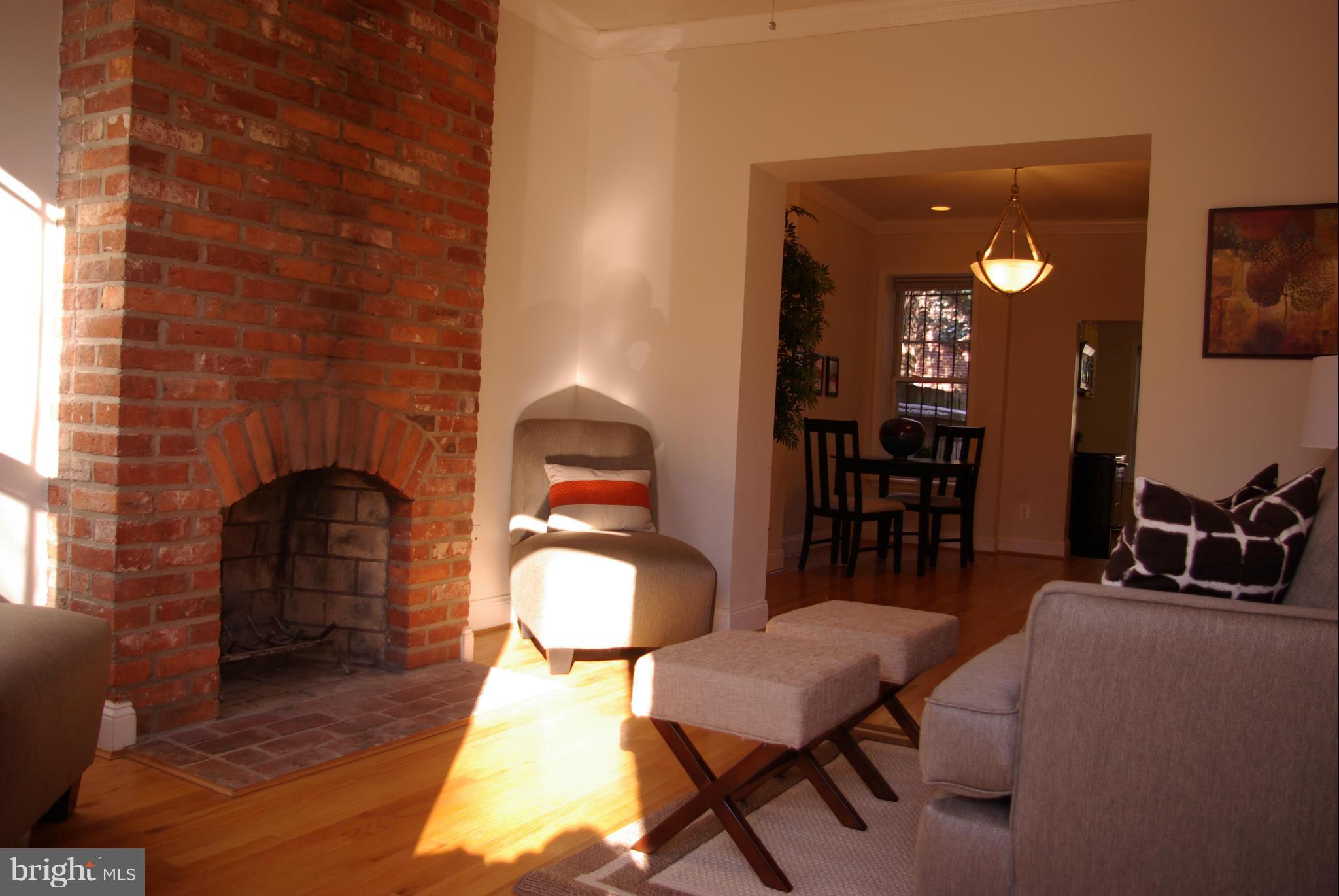318 11th Street Southeast Washington, DC 20003 - Photo 3 of 26 a dining room with furniture and wooden floor
