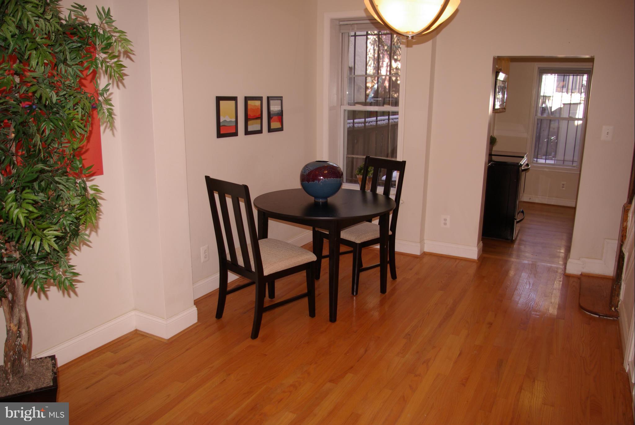 318 11th Street Southeast Washington, DC 20003 - Photo 5 of 26 a view of a dining room with furniture and wooden floor