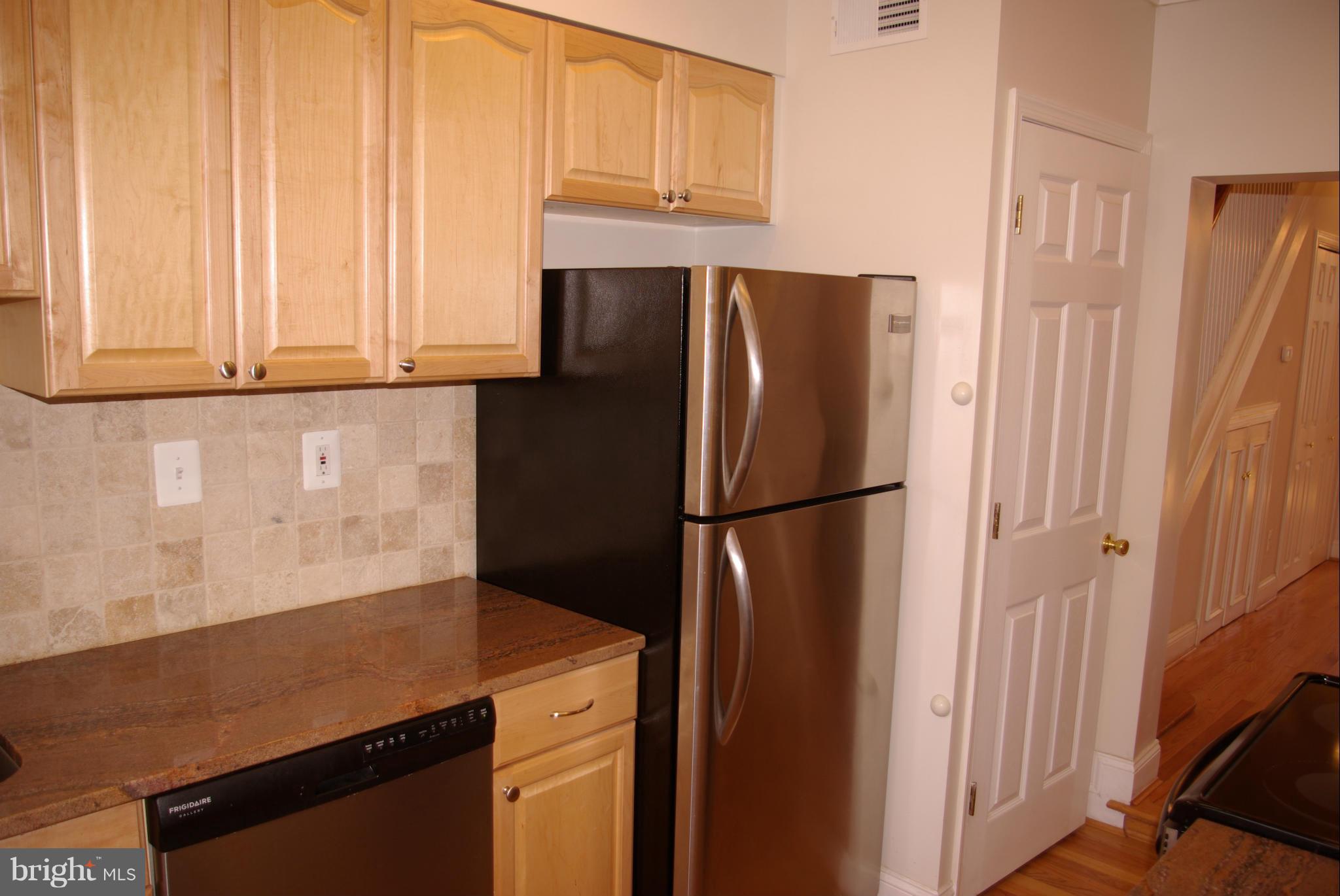 318 11th Street Southeast Washington, DC 20003 - Photo 7 of 26 a kitchen with refrigerator and window