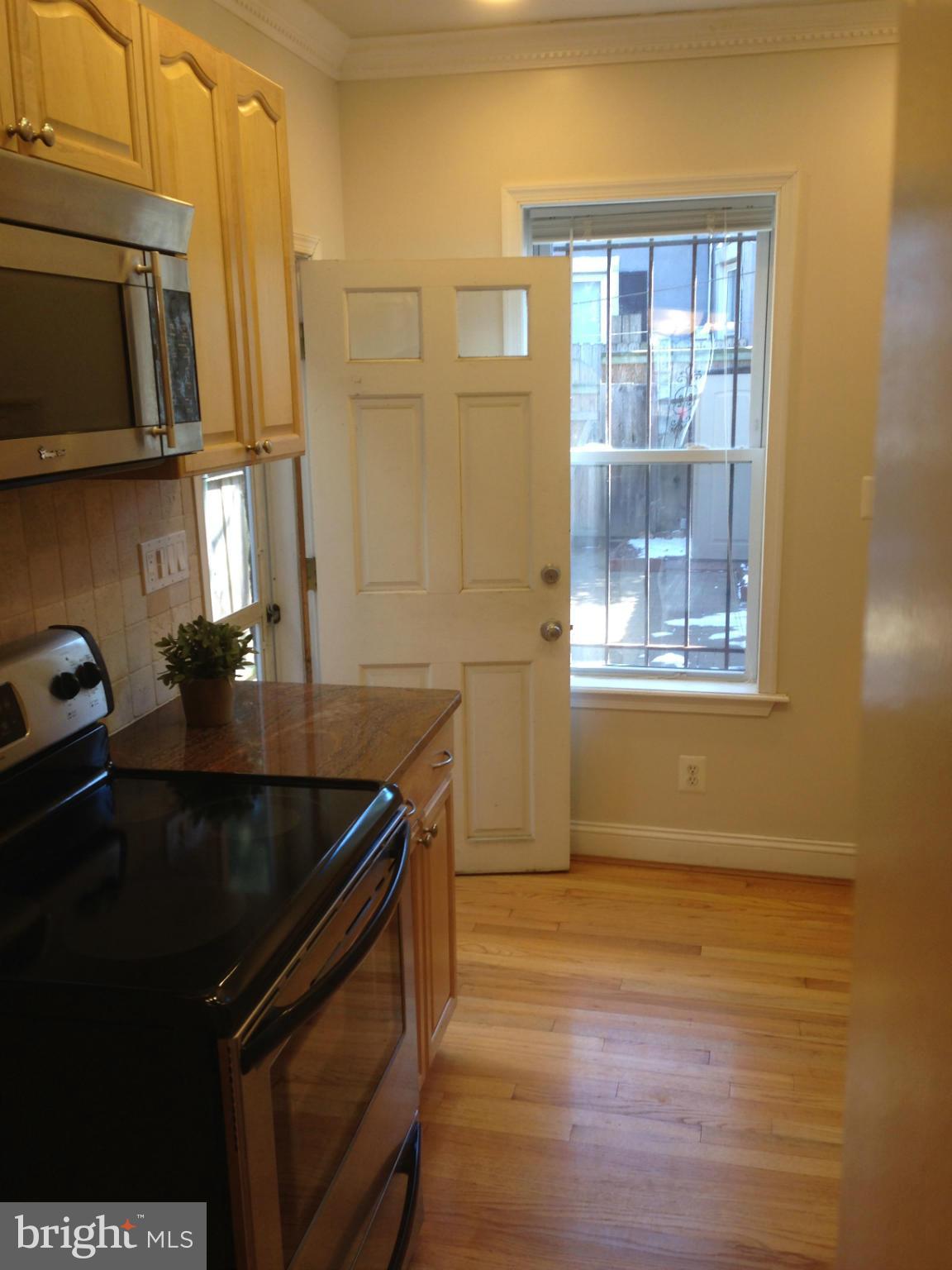 318 11th Street Southeast Washington, DC 20003 - Photo 9 of 26 a kitchen that has a sink and a stove