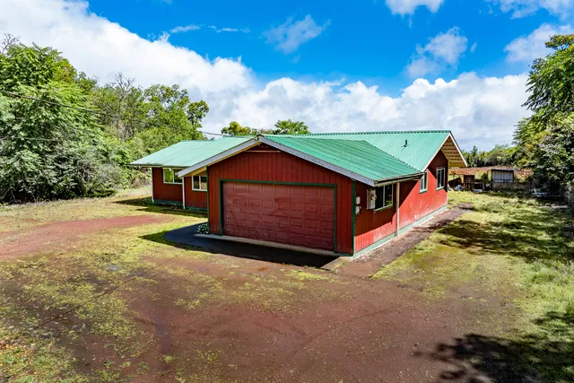 a view of house with backyard and entertaining space