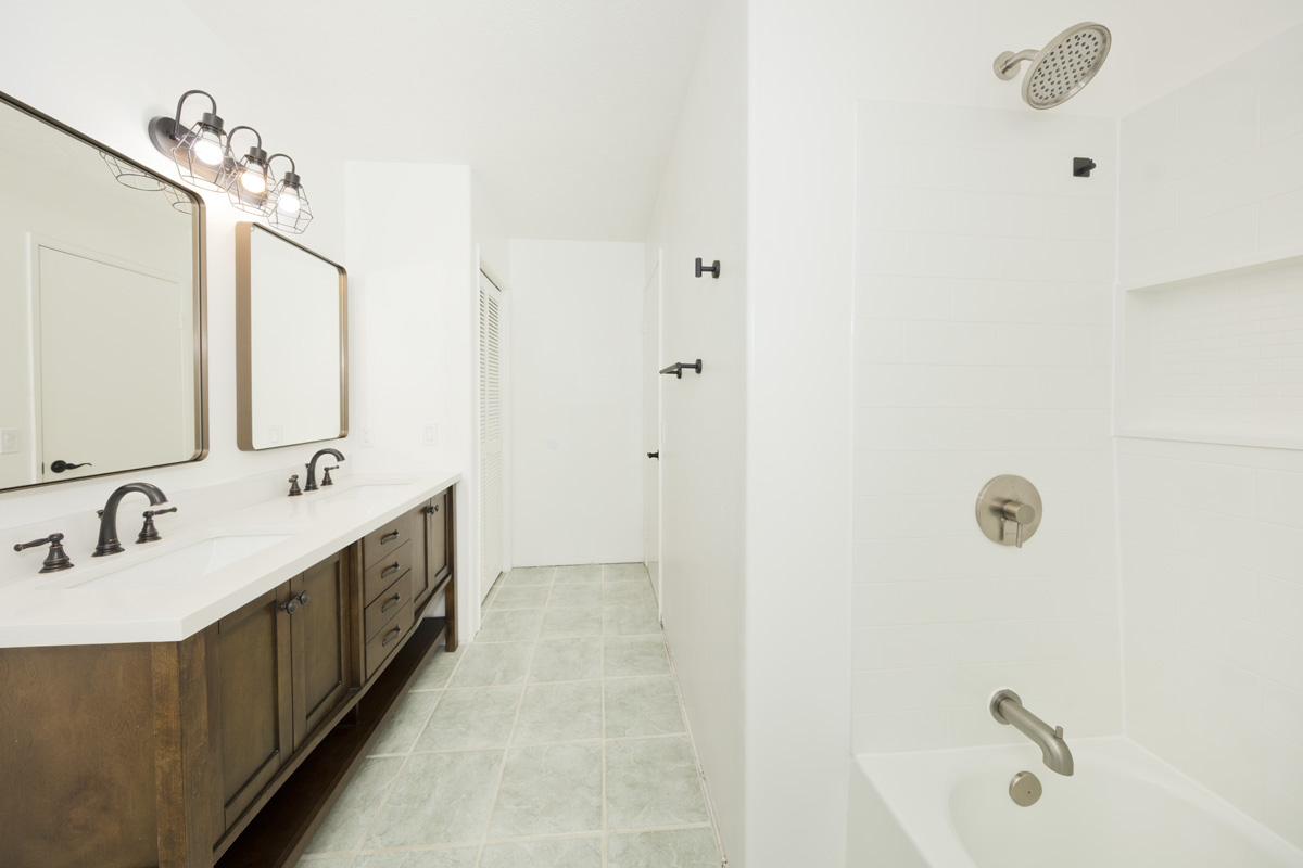 18-1465 Ihope Road Mountain View, HI 96771 - Photo 21 of 30 a bathroom with a double vanity sink and mirror