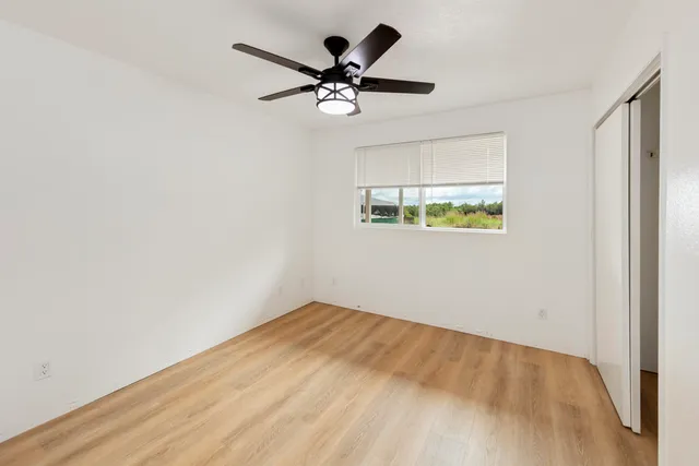 a view of room with a ceiling fan