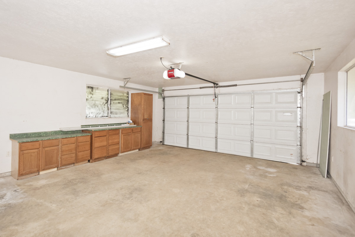 18-1465 Ihope Road Mountain View, HI 96771 - Photo 26 of 30 a view of a kitchen with cabinet and utility room