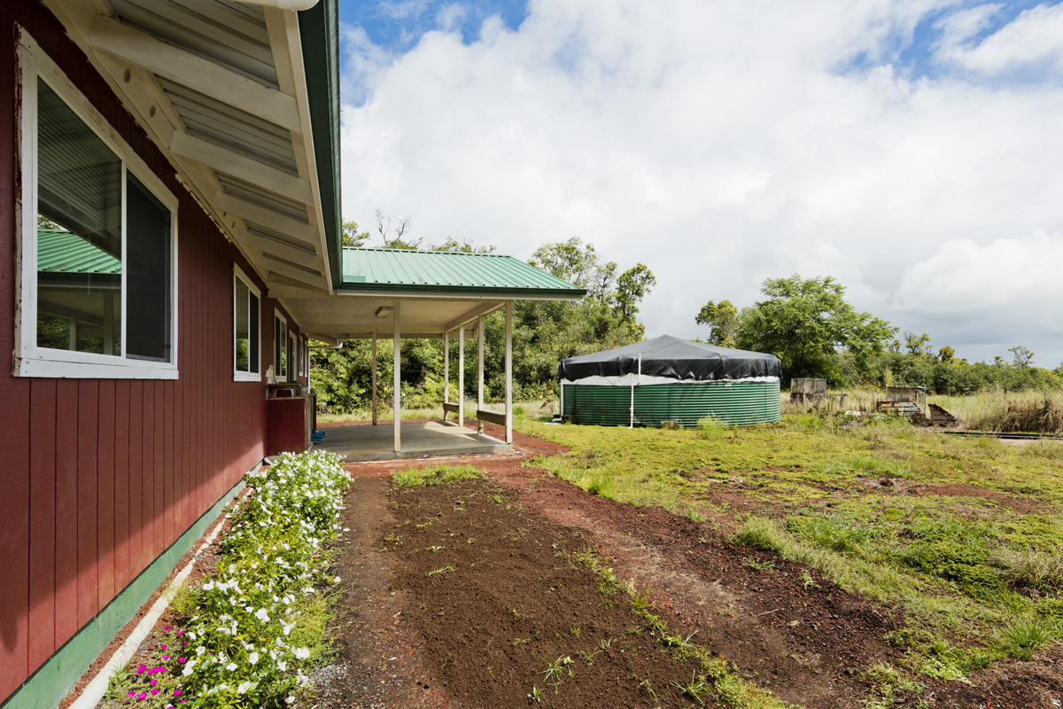 18-1465 Ihope Road Mountain View, HI 96771 - Photo 5 of 30 a front view of a house with a yard