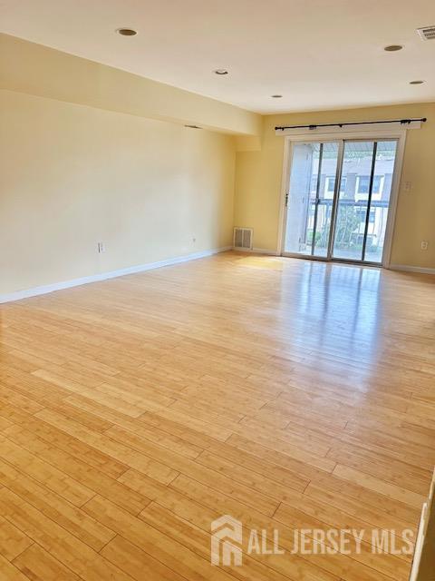 1730 Raspberry Court Edison, NJ 08817 - Photo 2 of 5 wooden floor in an empty room with a window