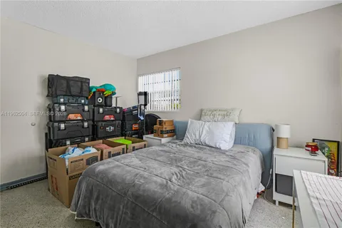a bed room with a bed furniture and a window