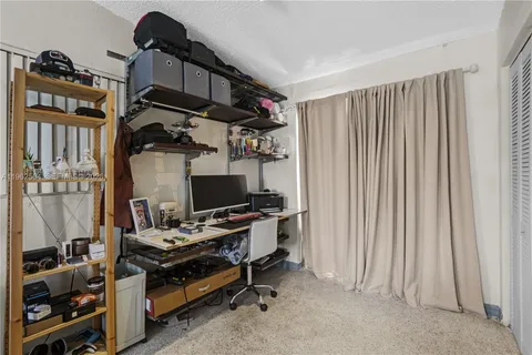 a room with furniture and gym equipment