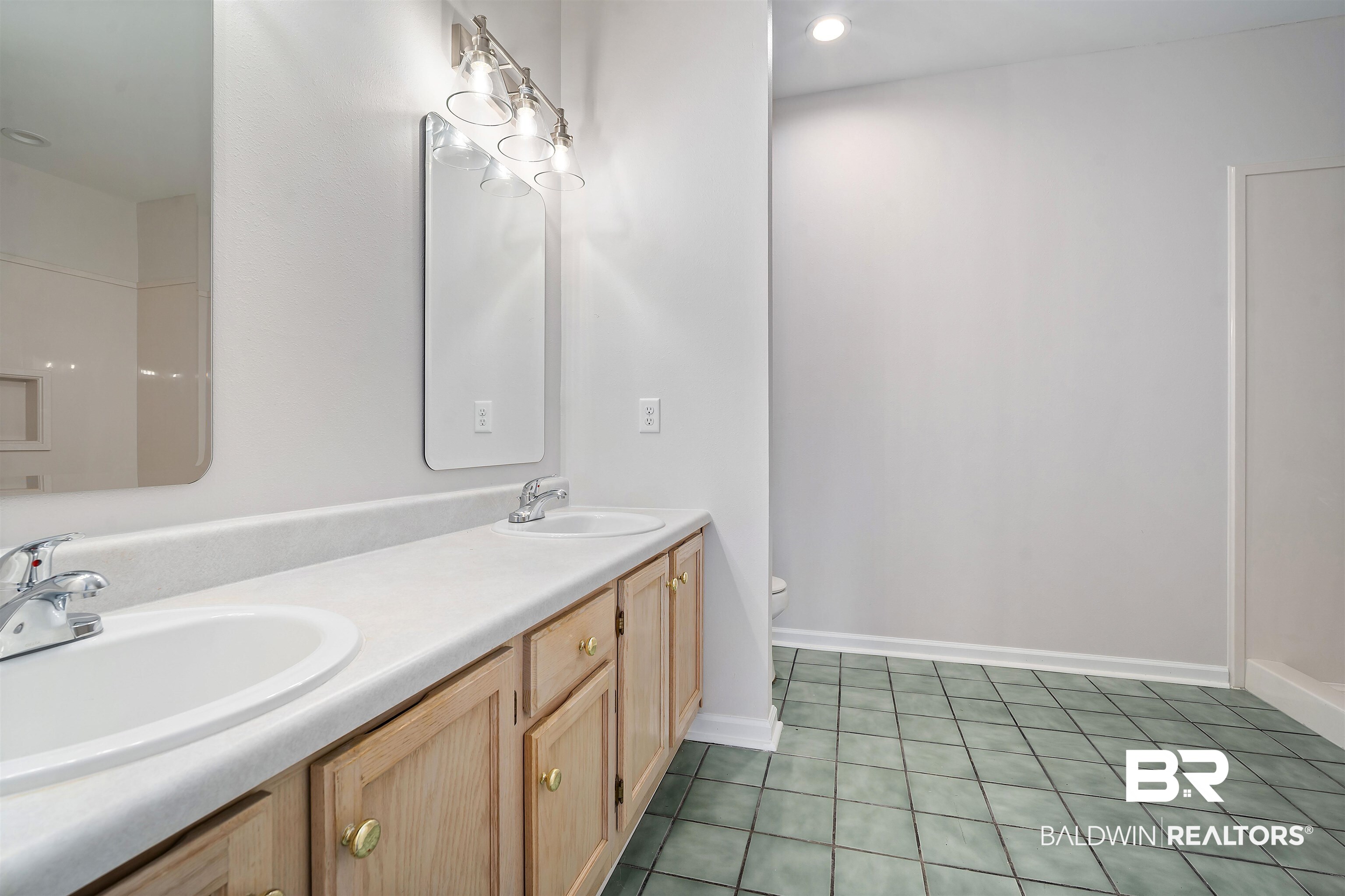 250 North Spring Lake Drive Mobile, AL 36695 - Photo 13 of 29 Bathroom with double vanity, new light fixtures and mirrors.