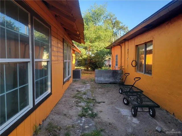a backyard of a house with seating space