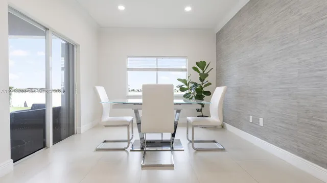a view of a dining room with furniture window and outside view