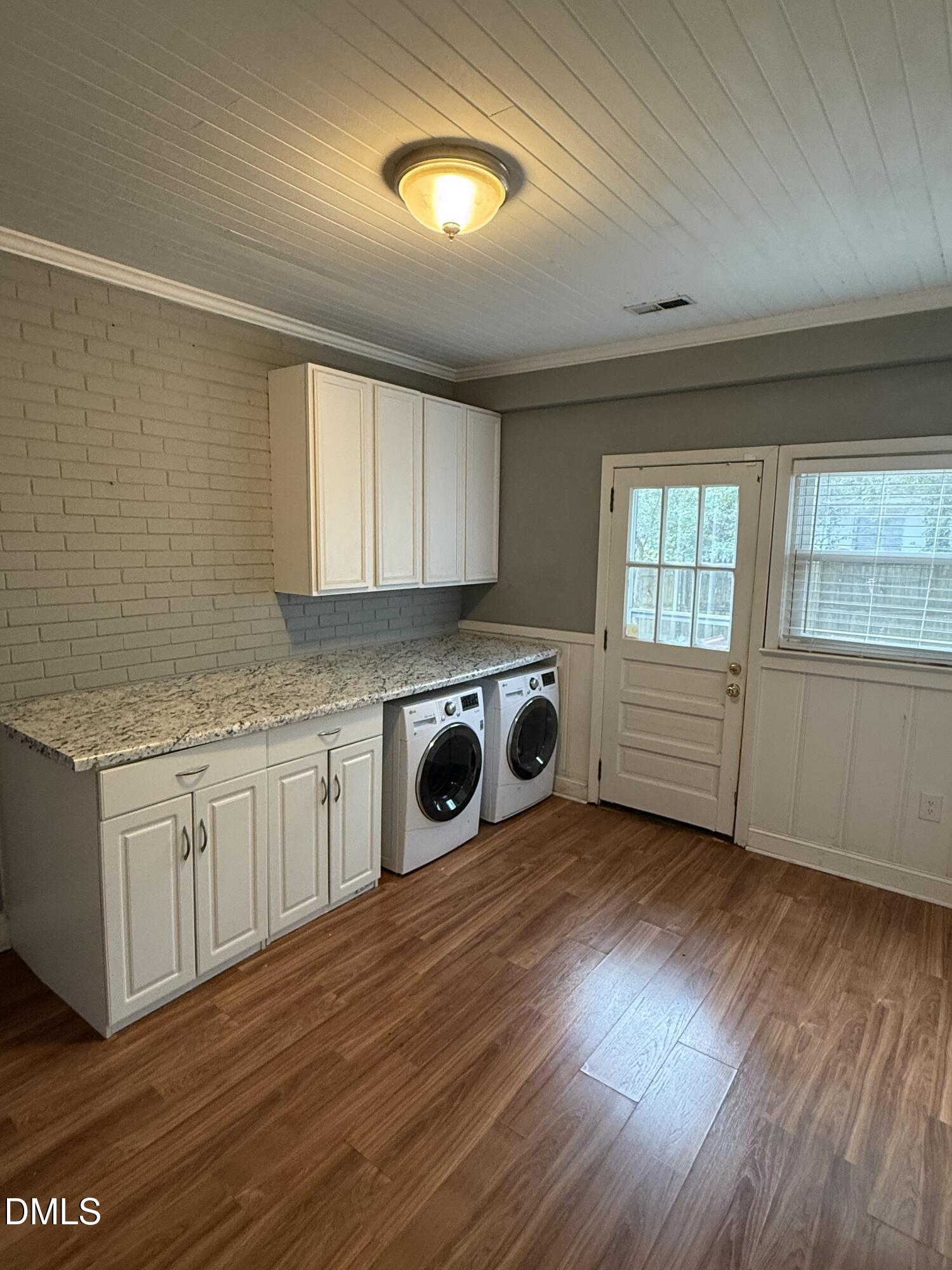 403 Brooks Avenue Raleigh, NC 27607 - Photo 8 of 9 a kitchen with stainless steel appliances granite countertop a sink cabinets and wooden floor